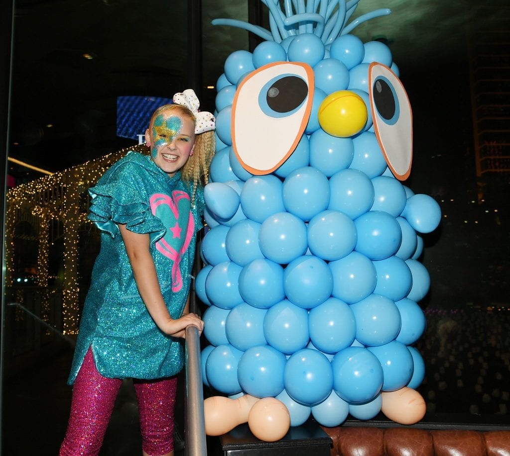 JoJo Siwa poses with life-size Angry Birds The Movie 2 character Jay.