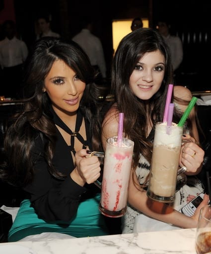 Kim Kardashian and Kylie Kardashian attend the grand opening of Sugar Factory American Brasserie