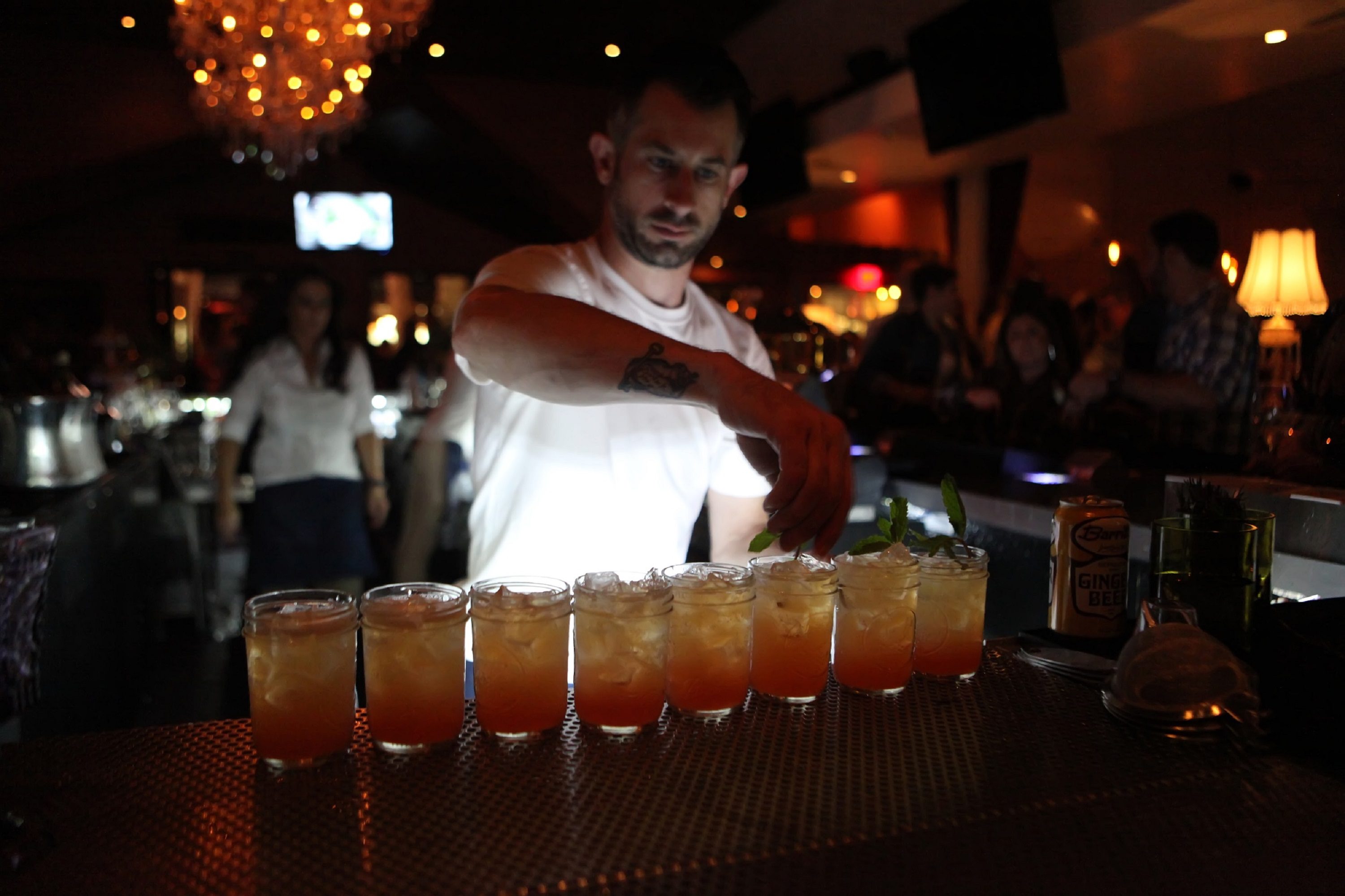 Bartender Serving Whist's Signature Cocktails