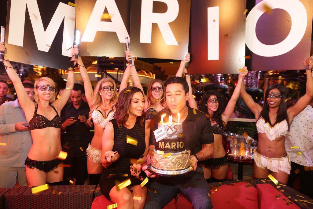 Mario Lopez blows out the candels on his birthday cake at XS Nightclub