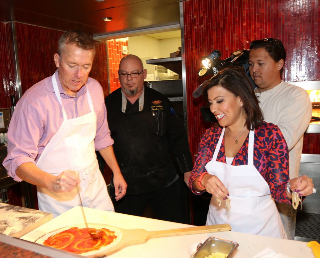 John Huck and Olivia Fierro with TREVI Executive Chef Peter Scaturro, middle, creating a pizza