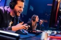 Local gamer Chelsea Maag plays the first game at Esports Arena Las Vegas with Esports Arena CEO Tyler Endres (L)
