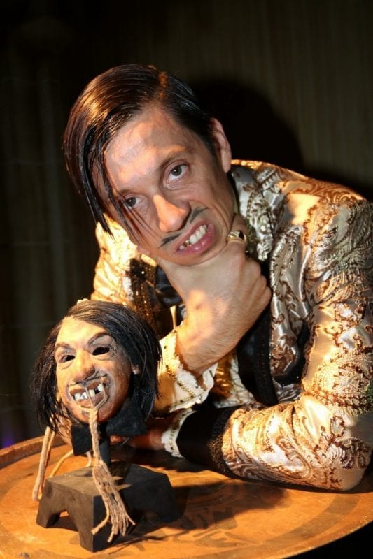 The Gazillionaire poses with his shrunken head at The Golden Tiki