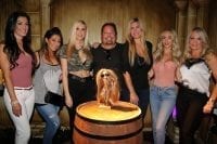 Vince Neil poses with girlfriend Rain Hannah and friends at The Golden Tiki