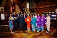 Silverton executives toast with Japanese dancers to Su Casa grand opening