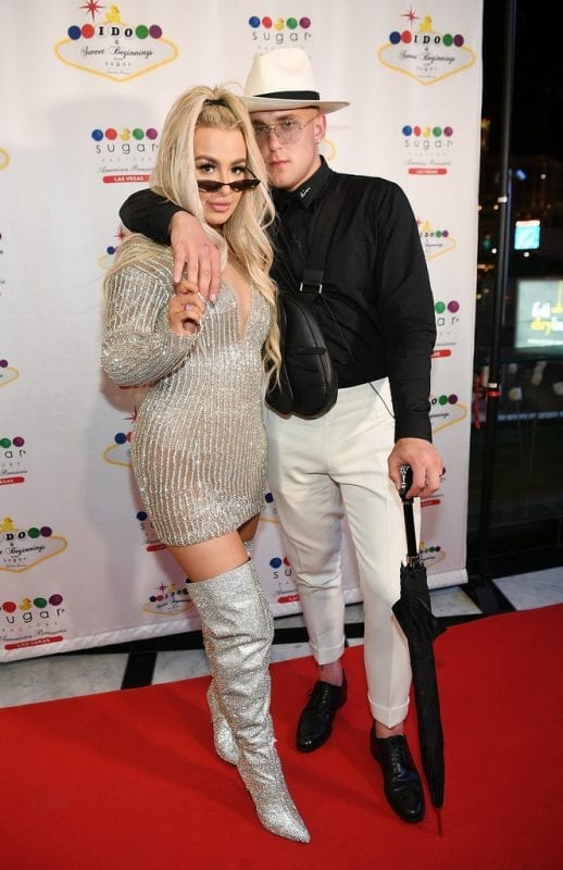 Jake Paul and Tana Mongeau pose on red carpet before reception.