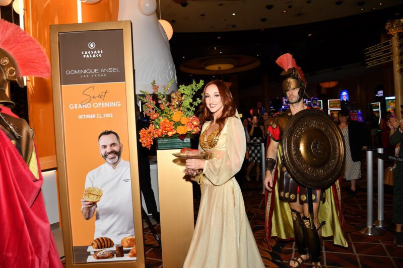 The Caesars Palace Handmaiden holds Cronut at the opening of Dominique Ansel Las Vegas