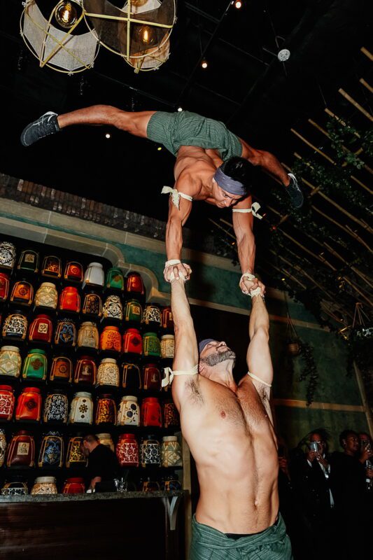 Hand balancers performing Muay Thai