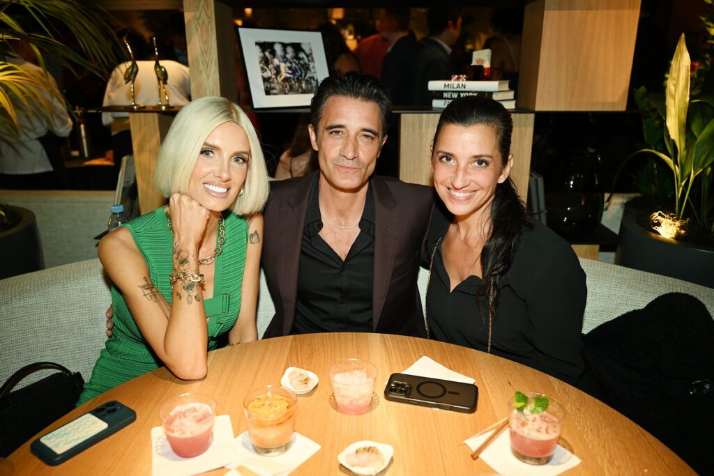 Nicole Young with Gilles and Carole Marini attend BOA Steakhouse grand opening