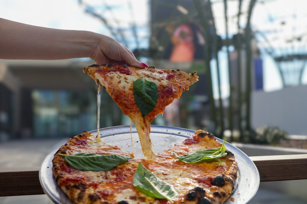 OG Pizza with cheese pull at How Ya Doughn