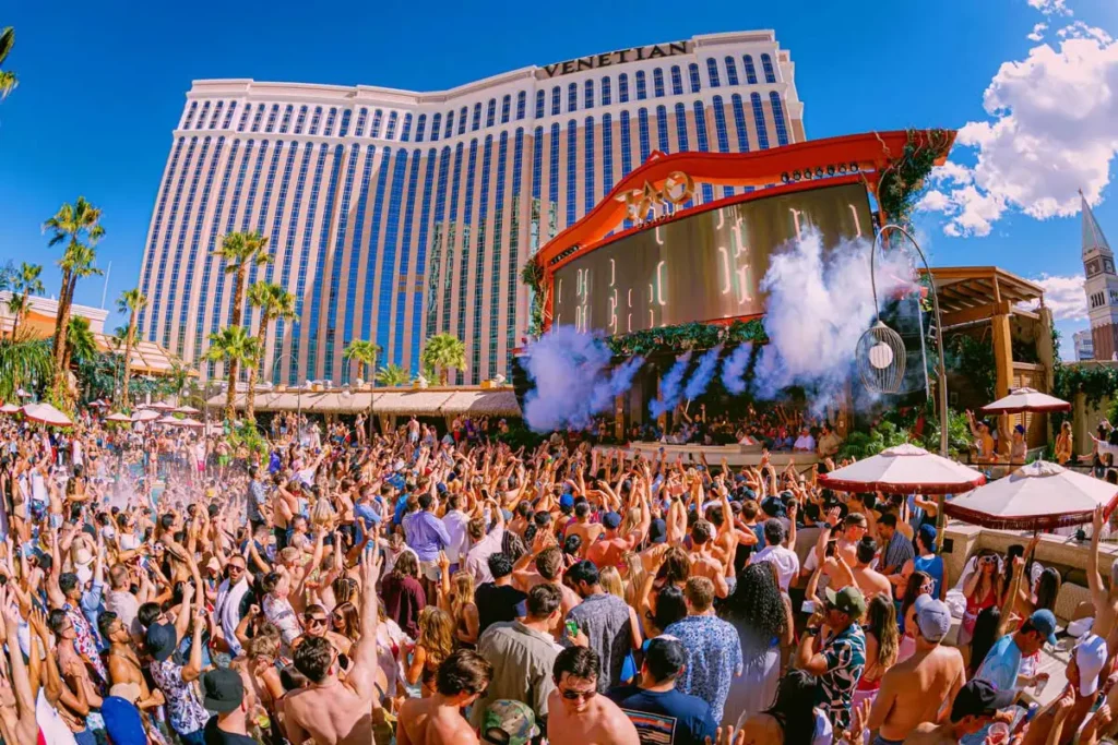 Guests enjoying a high-energy pool party at the Venetian.