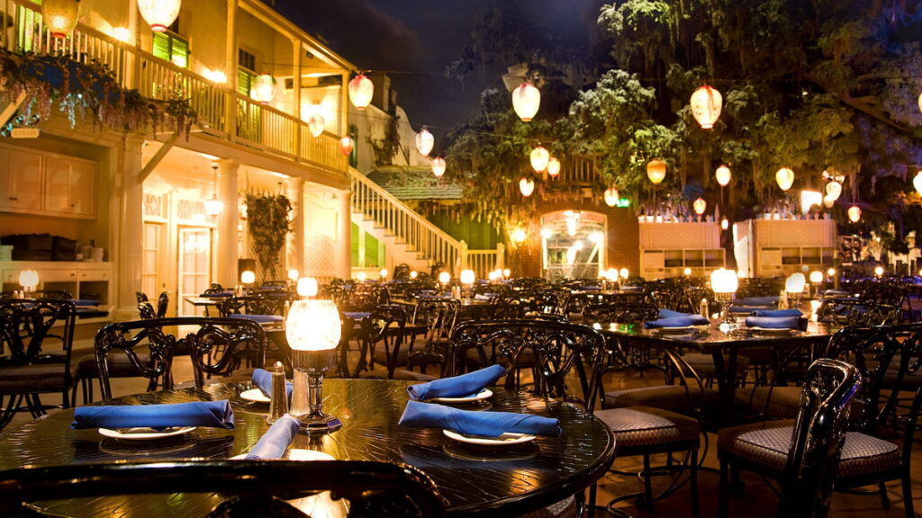 Blue Bayou Restaurant dining tables overlooking the bayou waterway in New Orleans Square, Disneyland